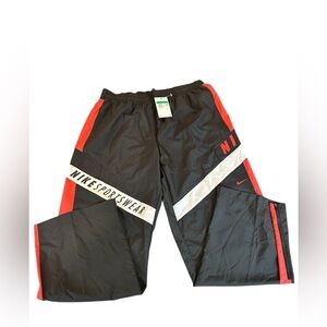 Nike Women’s Black Track Pants with Red and White Accents. Wide leg